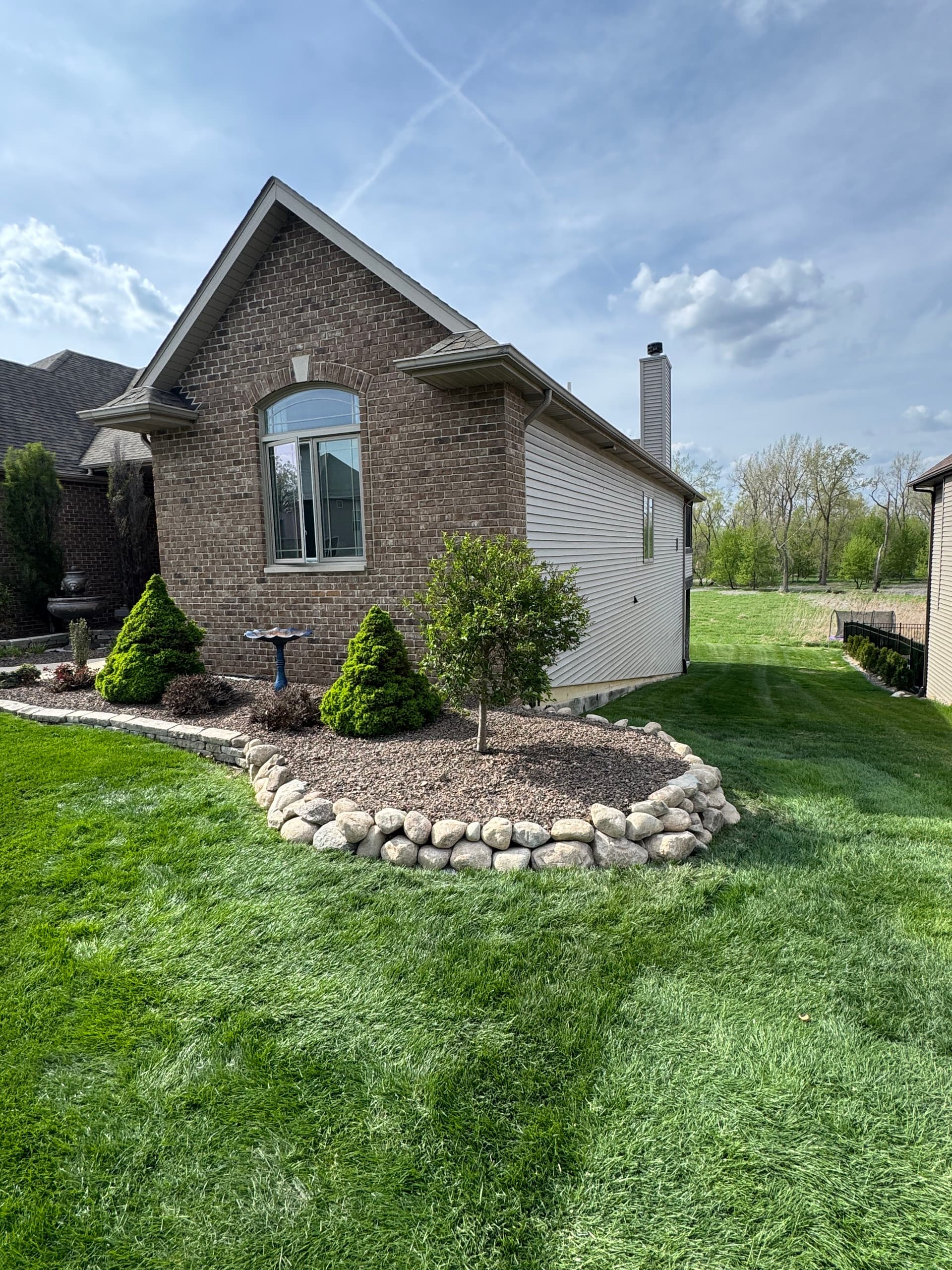 Gallery photos for Failing Limestone Wall Replaced with Boulder Wall in Crown Point: Image #2