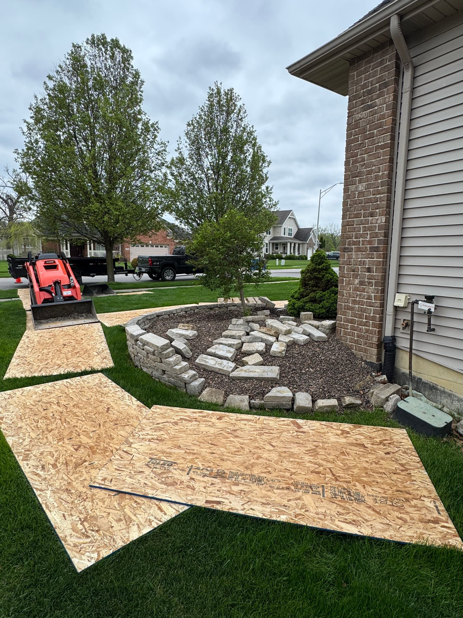 Failing Limestone Wall Replaced with Boulder Wall in Crown Point image