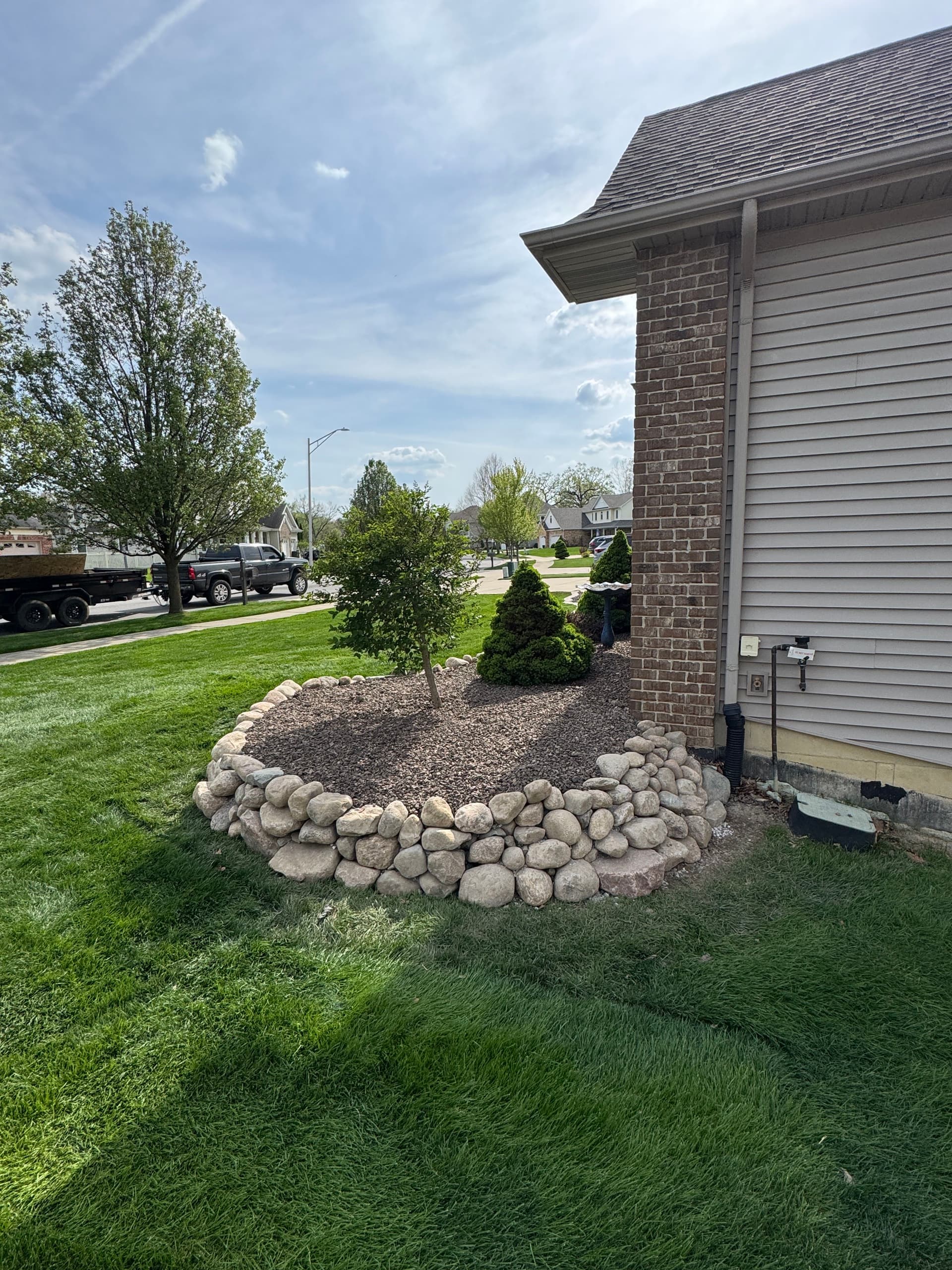 Gallery photos for Failing Limestone Wall Replaced with Boulder Wall in Crown Point: Image #1