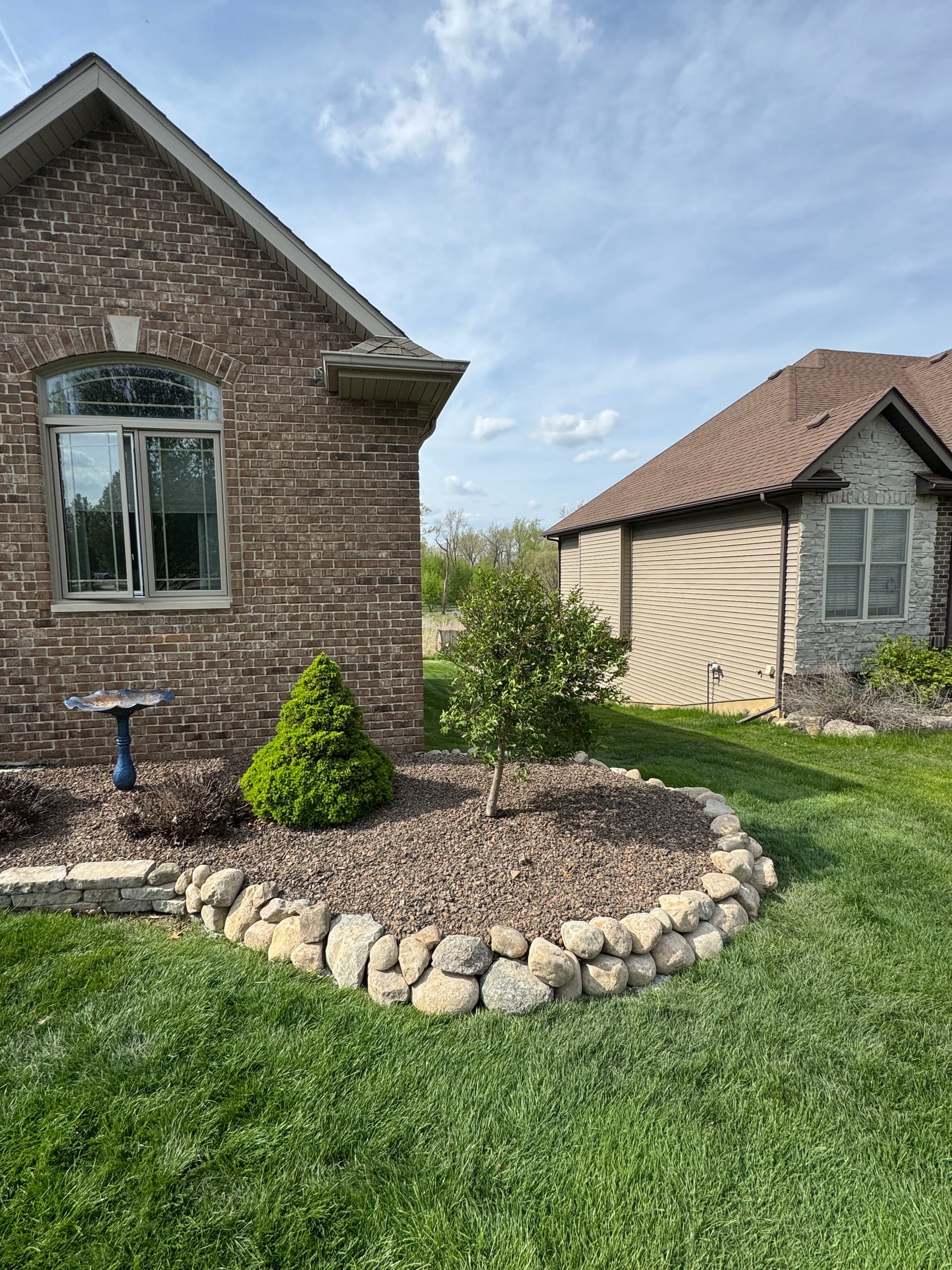 Gallery photos for Failing Limestone Wall Replaced with Boulder Wall in Crown Point: Image #3